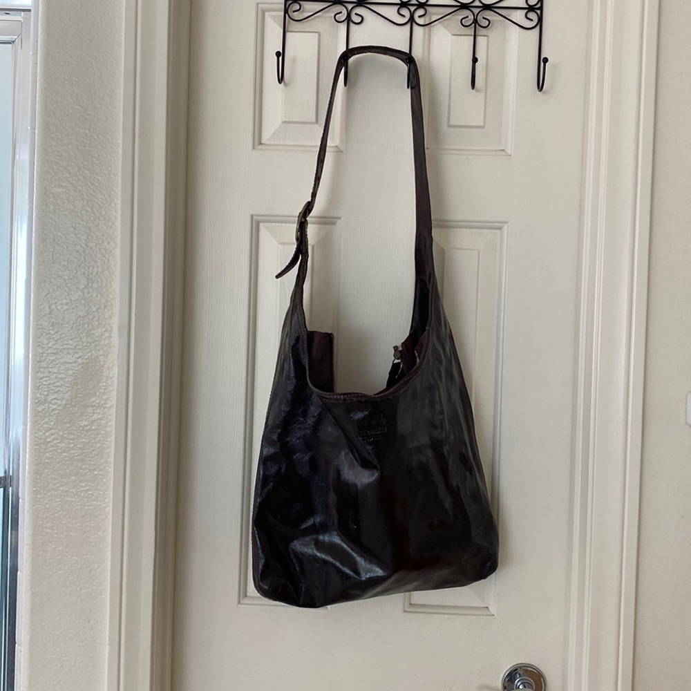 Large coach utility bag brown. Patent leather .